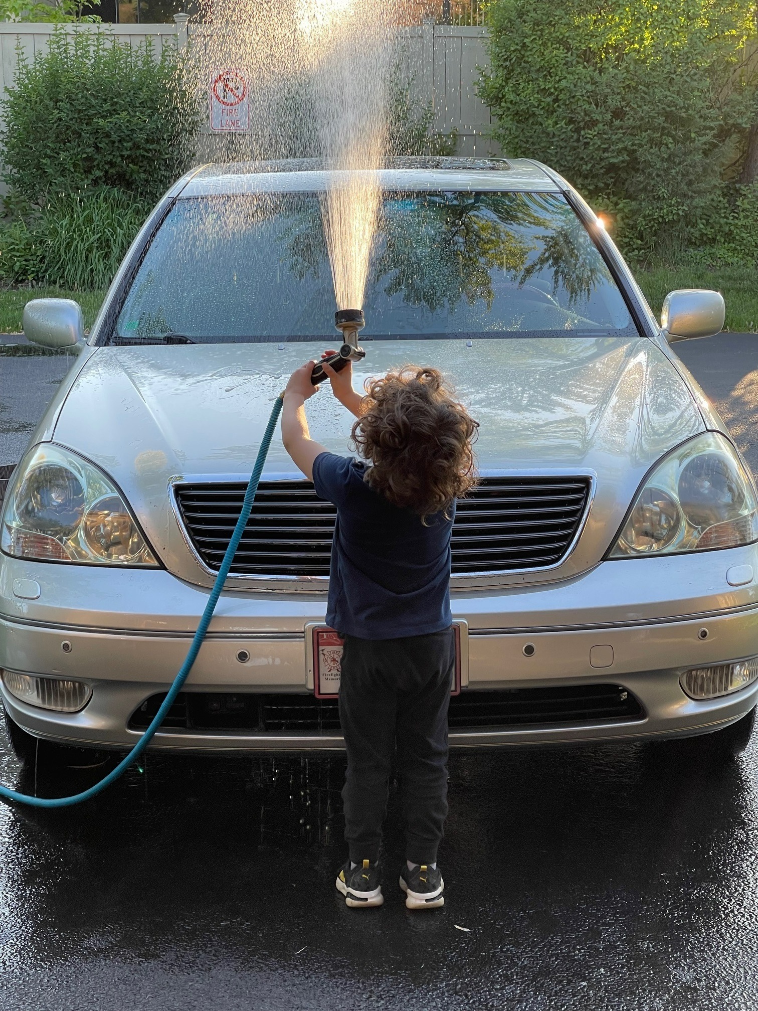 boy washing car